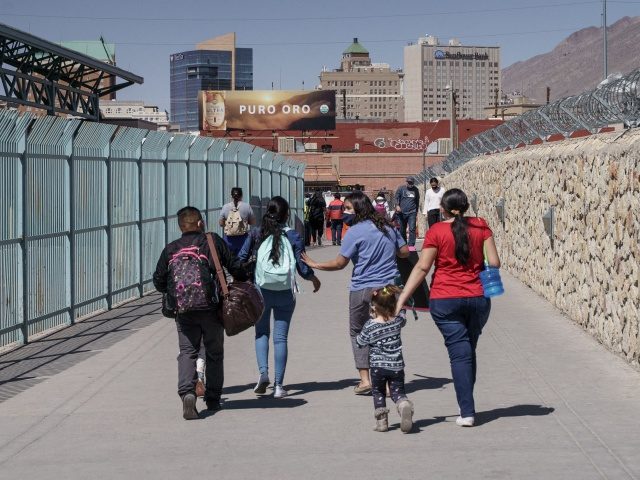 Migrants who had been in Mexico under the Migrant Protection Protocols, or the "Remain in Mexico" program, enter the United States at the Paso del Norte Bridge in El Paso, Texas on March 10, 2021. - Migrants in the Trump-era Migrant Protection Protocols (MPP), or the "Remain in Mexico" program, …
