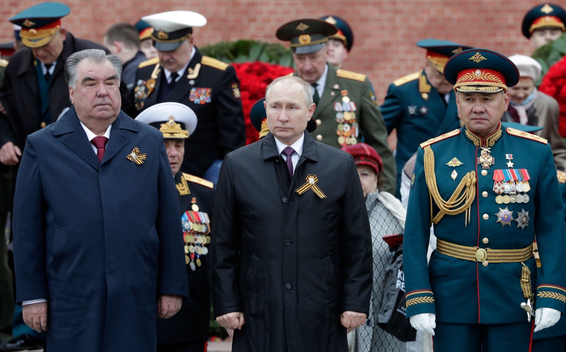 Russian President Vladimir Putin, Tajikistan's President Emomali Rakhmon and Russian Defence Minister Sergei Shoigu attend a flower-laying ceremony at the Tomb of the Unknown Soldier after the Victory Day military parade in Moscow on May 9, 2021. - Russia celebrates the 76th anniversary of the victory over Nazi Germany during World War II. (Photo by Mikhail METZEL / SPUTNIK / AFP) (Photo by MIKHAIL METZEL/SPUTNIK/AFP via Getty Images)