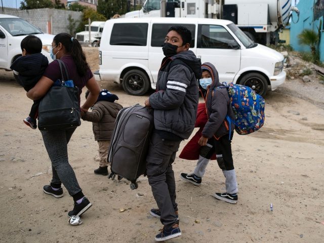 Brillite (L), a 34-year-old migrant from Mexico, and her four children leave the Agape shelter in Tijuana, Baja California State, Mexico, heading to the border to start their asylum request process in the United States, on May 10, 2021. - Brillite, who flee her home state of Guerrero two years …