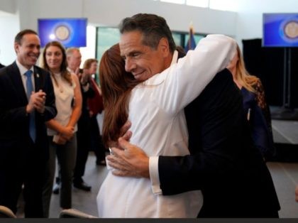 New York Governor Andrew Cuomo hugs Northwell Health Director of Patient Services Sandra Lindsey, after an event to announce that New York will lift 'virtually all' Covid-19 restrictions, after the state cleared the threshold of 70 percent vaccinated, at One World Trade Center in New York on June 15, 2021. …