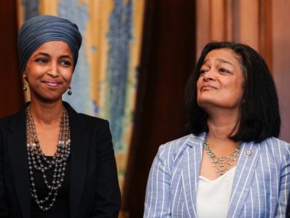 WASHINGTON, DC - JUNE 17: Reps. Ilhan Omar (D-MI) and Pramila Jayapal (D-WA) listen as Speaker of the House Nancy Pelosi (D-CA) holds a bill enrollment signing ceremony for the Juneteenth National Independence Day Act on June 17, 2021 on Capitol Hill in Washington, DC. Juneteenth, celebrated on June 19th, …