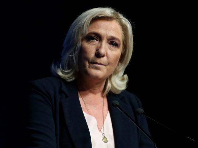French far-right Rassemblement National (RN) party leader and member of parliament Marine Le Pen looks on on stage during a congress of the party in Perpignan, southern France, on July 4, 2021. - Marine Le Pen won re-election as head of France's far-right National Rally on July 4 at a …