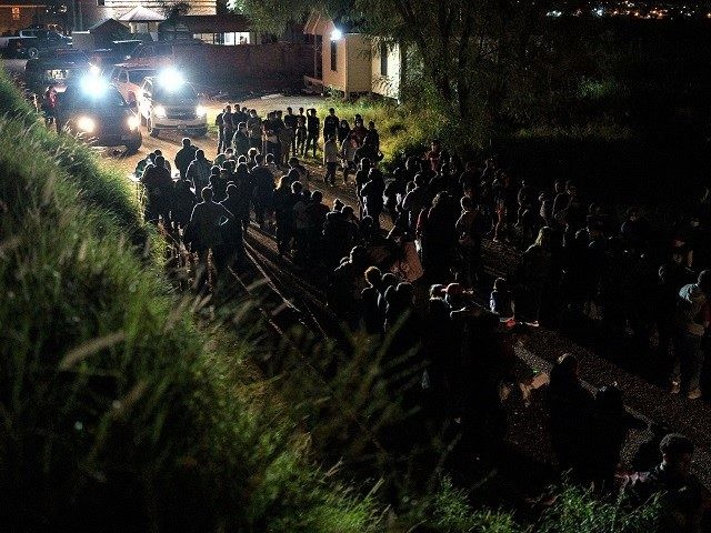United States Border Patrol agents process migrants who crossed the US-Mexico border into