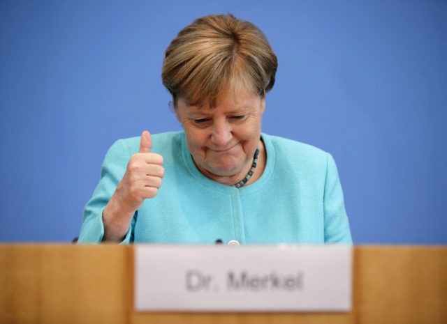 German Chancellor Angela Merkel gives the thumbs up as she holds her annual summer press conference on national and international topics at the house of the Federal Press Conference (Bundespressekonferenz) on July 22, 2021 in Berlin. (Photo by HANNIBAL HANSCHKE / POOL / AFP) (Photo by HANNIBAL HANSCHKE/POOL/AFP via Getty …