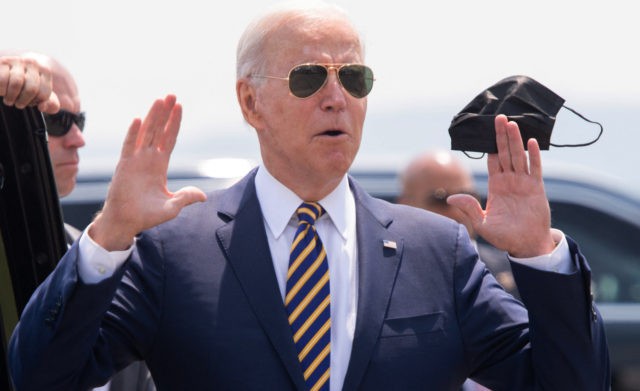 US President Joe Biden answers a question from the press as he holds a mask upon arrival on Air Force One at Lehigh Valley International Airport in Allentown, Pennsylvania, July 28, 2021, as he travels to speak on the economy. (Photo by SAUL LOEB / AFP) (Photo by SAUL LOEB/AFP …
