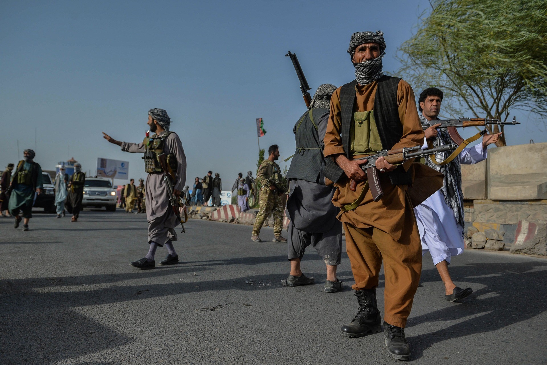 Afghan security personnel and Afghan militia fighting against Taliban, stand guard in Enjil district of Herat province on July 30, 2021. (Photo by Hoshang Hashimi / AFP) (Photo by HOSHANG HASHIMI/AFP via Getty Images)