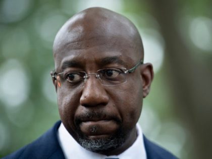 Sen. Raphael Warnock(R) (D-GA) speaks to people rallying for voters' rights on Capitol Hill on August 3, 2021, in Washington, DC. (Photo by Brendan Smialowski / AFP) (Photo by BRENDAN SMIALOWSKI/AFP via Getty Images)
