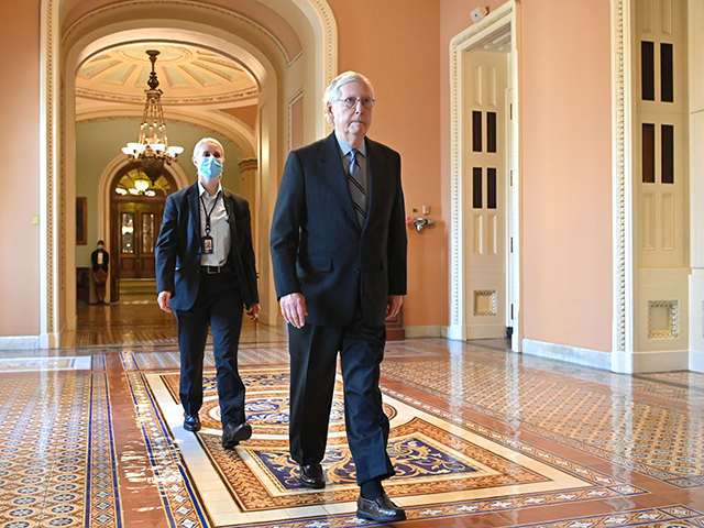 Senate Minority Leader Mitch McConnell(R) (R-KY) returns to his office after voting at the US Capitol after a Senate vote on the passage of a massive infrastructure plan in Washington, DC on August 10, 2021. - The US Senate on August 10, 2021 approved the colossal $1.2 trillion infrastructure investment …
