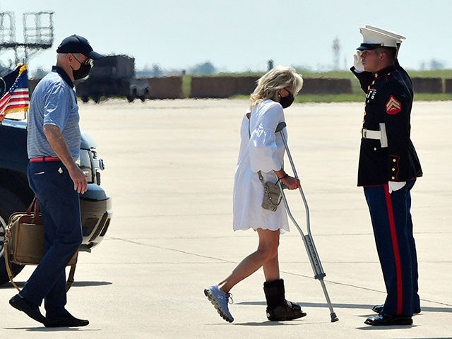 US President Joe Biden (L) and First Lady Jill Biden (C) board Marine One at Delaware Air