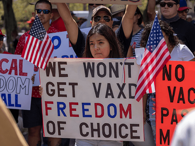 Anti-vaccination protesters pray and rally near City Hall following the Los Angeles City Council vote earlier this week to draw up an ordinance to require proof of vaccination to enter many public indoor spaces in Los Angeles, August 14, 2021. (Photo by DAVID MCNEW / AFP) (Photo by DAVID MCNEW/AFP via Getty Images)