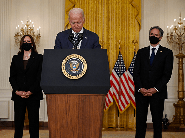 US President Joe Biden, with Vice President Kamala Harris (L) and Secretary of State Antony Blinken, speaks about the ongoing US military evacuations of US citizens and vulnerable Afghans, in the East Room of the White House in Washington, DC, on August 20, 2021. - Biden said Friday he could not guarantee the final outcome of the emergency evacuation from Kabul's airport, calling it one of the most "difficult" airlift operations ever. (Photo by Andrew CABALLERO-REYNOLDS / AFP) (Photo by ANDREW CABALLERO-REYNOLDS/AFP via Getty Images)