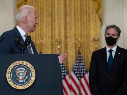 US President Joe Biden, with Secretary of State Antony Blinken (R), speaks about the ongoing US military evacuations of US citizens and vulnerable Afghans, in the East Room of the White House in Washington, DC, on August 20, 2021. - Biden said Friday he could not guarantee the final outcome …