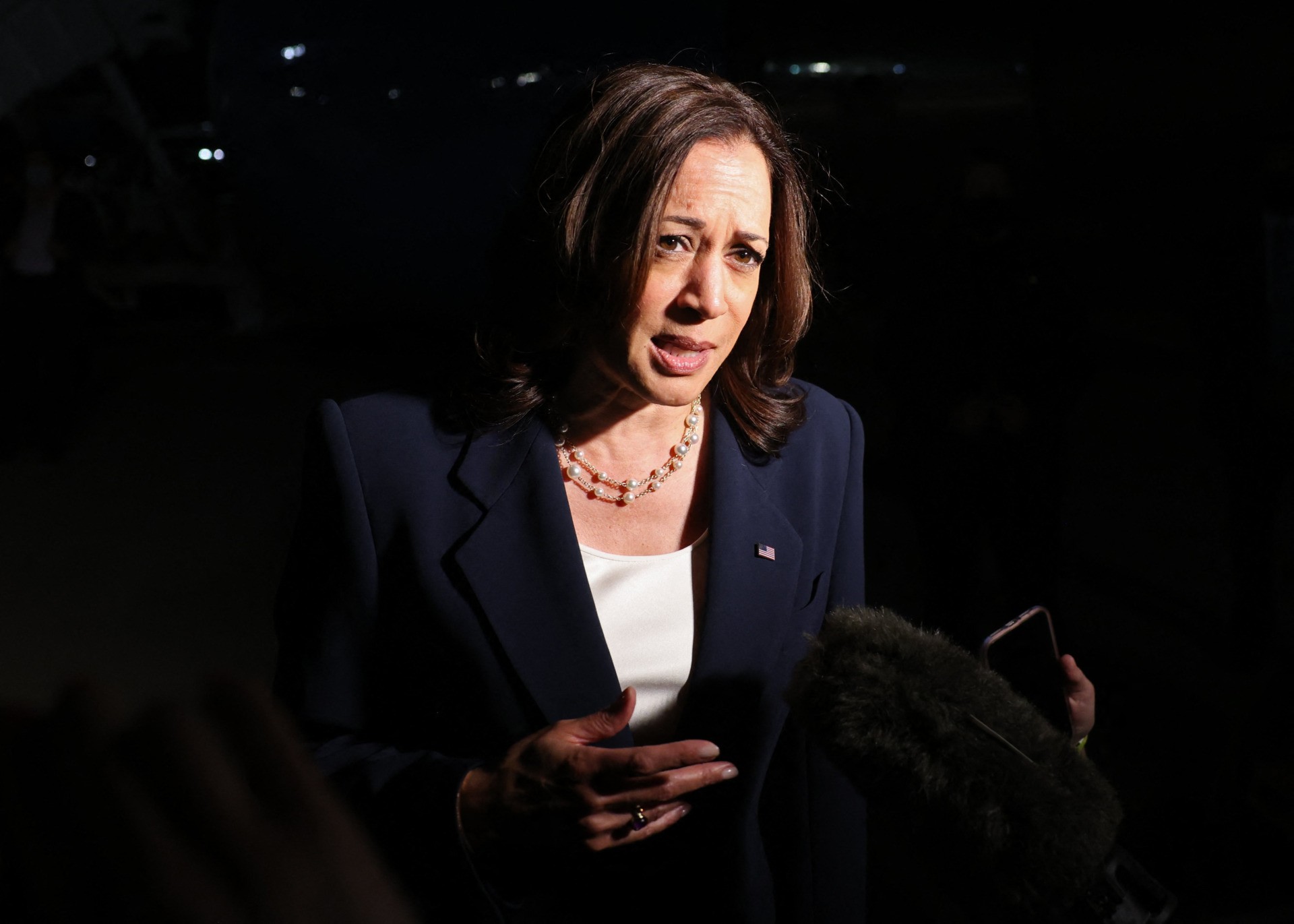 US Vice President Kamala Harris speaks before departing for travel to Southeast Asia, her first trip to this region as vice president to meet with government, private sector, and civil society leaders, at Joint Base Andrews in Maryland, August 20, 2021. (Photo by EVELYN HOCKSTEIN / POOL / AFP) (Photo by EVELYN HOCKSTEIN/POOL/AFP via Getty Images)