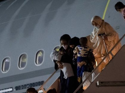 Passengers evacuated from Afghanistan disembark from a British Royal Air Force (RAF) Airbus KC2 Voyager aircraft, after landing at RAF Brize Norton station in southern England on August 24, 2021. - Britain said on August 23 it would urge the United States to extend an end-of-the-month deadline for evacuations from …