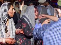 Photos: Afghans Use Wheelbarrows to Tend to Bomb Victims at Kabul Airport