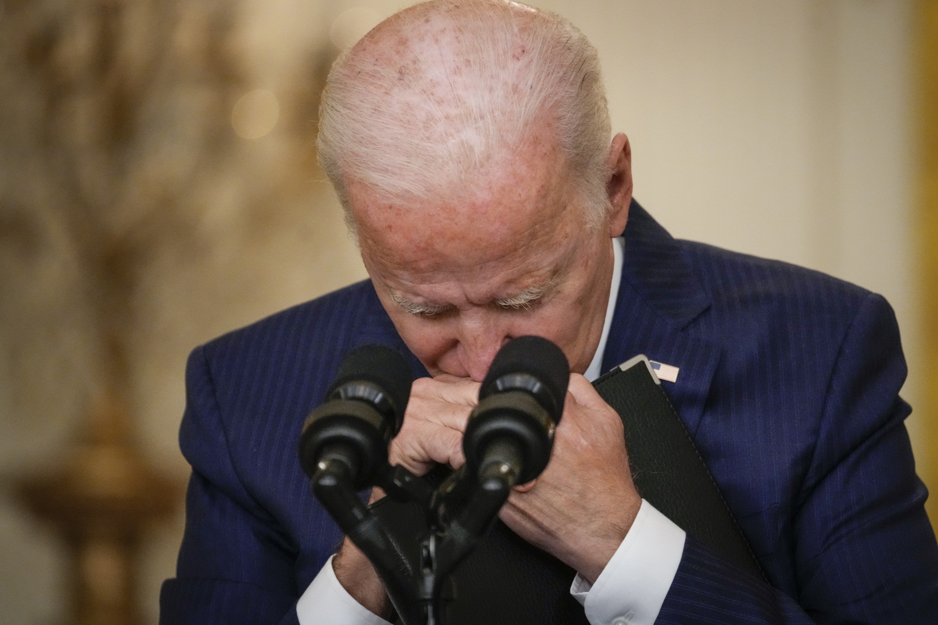 WASHINGTON, DC - AUGUST 26: U.S. President Joe Biden pauses while listening to a question from a reporter about the situation in Afghanistan in the East Room of the White House on August 26, 2021 in Washington, DC. At least 12 American service members were killed on Thursday by suicide bomb attacks near the Hamid Karzai International Airport in Kabul, Afghanistan. (Photo by Drew Angerer/Getty Images)