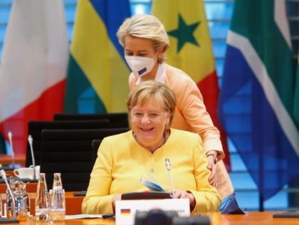 German Chancellor Angela Merkel (L) is greeted by European Commission President Ursula von der Leyen at the G20 Compact with Africa (CwA) meeting at the Chancellery in Berlin on August 27, 2021. (Photo by MICHELE TANTUSSI / POOL / AFP) (Photo by MICHELE TANTUSSI/POOL/AFP via Getty Images)