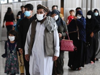 Afghan refugees arrive at Dulles International Airport on August 27, 2021 in Dulles, Virgi