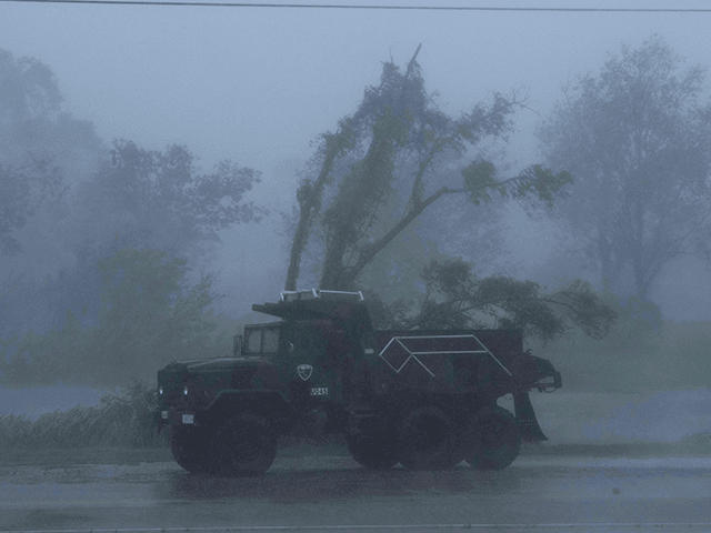 A truck is seen in heavy winds and rain from hurricane Ida in Bourg, Louisiana on August 29, 2021. - Hurricane Ida struck the coast of Louisiana Sunday as a powerful Category 4 storm, 16 years to the day after deadly Hurricane Katrina devastated the southern US city of New …