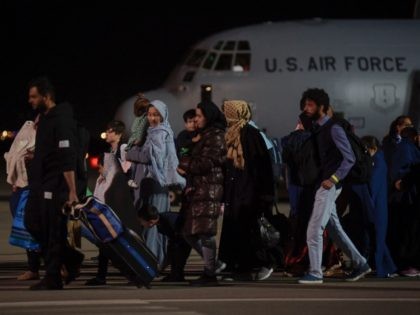 Evacuation -- Afghan refugees, fleeing the Afghan capital Kabul, exit an US air force plan