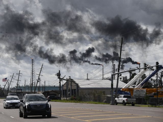 TOPSHOT - Vehicles drive past a petrol chemical plant near Highway 61 in Norco, Louisiana,