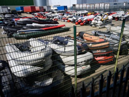 DOVER, ENGLAND - AUGUST 11: A storage yard for the dinghies, ribs and rowing boats previously used by migrants to cross the English Channel from France is seen on August 11, 2020 in Dover, England. In recent weeks large numbers of migrants have travelled in small boats across the English …