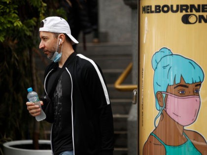 MELBOURNE, AUSTRALIA - NOVEMBER 23: A man is seen wearing a face mask on his chin on Novem