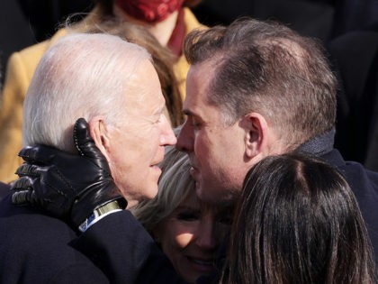 WASHINGTON, DC - JANUARY 20: U.S. President Joe Biden hugs his son Hunter Biden, wife Dr.