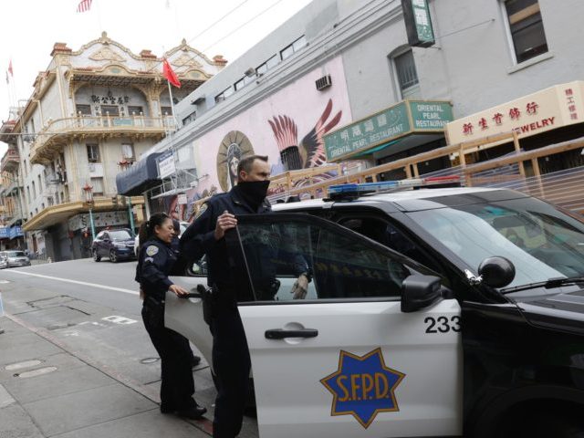 SAN FRANCISCO, CALIFORNIA - MARCH 17: San Francisco police officers patrol Chinatown on Ma