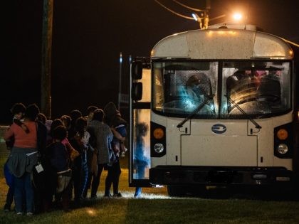 LA JOYA, TEXAS - JUNE 21: Migrants board a bus to be taken to a border patrol processing facility after crossing the Rio Grande into the U.S. on June 21, 2021 in La Joya, Texas. A surge of mostly Central American immigrants crossing into the United States has challenged U.S. …