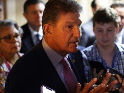 WASHINGTON, DC - JULY 15: U.S. Sen. Joe Manchin (D-WV) (C) talks to reporters as he leaves after a meeting with members of Texas House Democratic Caucus at the U.S. Capitol July 15, 2021 in Washington, DC. Members of Texas House Democratic Caucus continued their efforts to meet with U.S. …