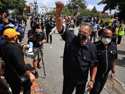 Civil Rights leader Rev. Jesse Jackson lifts his fist into the air after being arrested and released with hundreds of protesters who marched on Capitol Hill as part of the Poor People's Campaign to demand stronger voting rights, an end to the filibuster, immigration reform, a $15 minimum wage and …