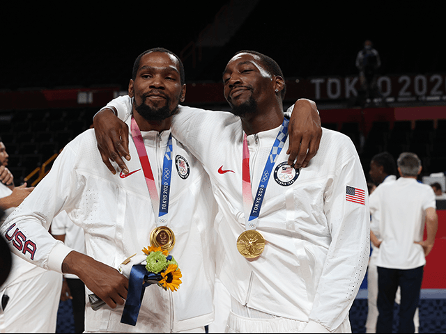 Bam Adebayo and Kevin Durant of Team United States pose for photographs with their gold medals during the Men's Basketball medal ceremony on day fifteen of the Tokyo 2020 Olympic Games at Saitama Super Arena on August 07, 2021 in Saitama, Japan. (Photo by Kevin C. Cox/Getty Images)