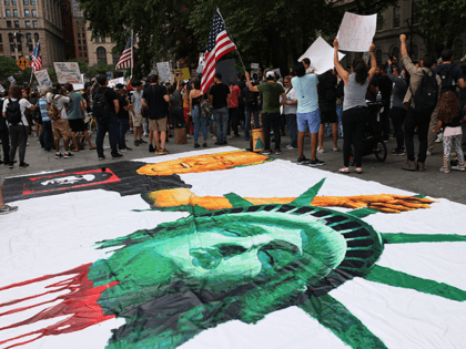 NEW YORK, NEW YORK - AUGUST 09: People gather at City Hall to protest vaccine mandates on