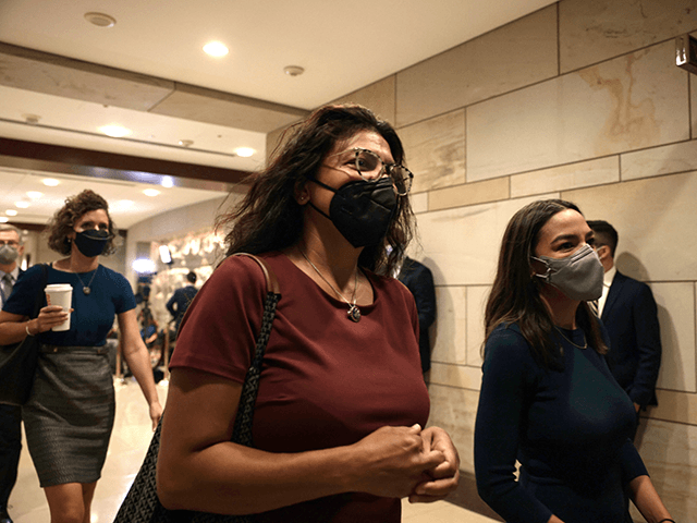 Rep. Rashida Tlaib (D-MI) (L) and Rep. Alexandria Ocasio-Cortez (D-NY) (R) arrive for a briefing with the House of Representatives on the situation in Afghanistan at the U.S. Capitol on August 24, 2021 in Washington, DC.