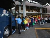 Judge Blocks Texas from Halting Bussing of Border Crossers into U.S.
