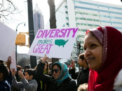 ATLANTA, GA - FEBRUARY 04: Wendy Gutierrez waves a sign during an Interfaith Rally for Mus