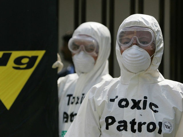 New Delhi, INDIA: Greenpeace environmental activists are dressed in protection suits at a