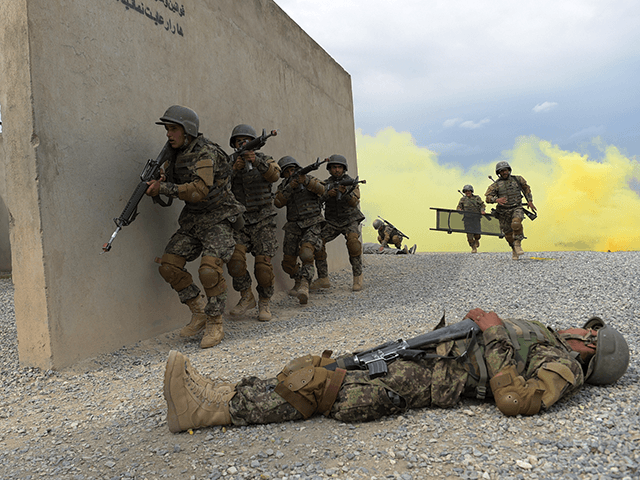 In this photograph taken on May 3, 2017, Afghan National Army (ANA) soldiers train at the Kabul Military training centre (KMTC) on the outskirts of Kabul. Fresh recruits to Afghanistan's elite special operations forces will soon be on the frontline of the war against a resurgent Taliban -- a battle US President Donald Trump has vowed "to win" by putting more American boots on the ground indefinitely. Camp Morehead, a former Soviet base near Kabul, is one of two training bases where the commandos are drilled by Afghan instructors in a programme overseen by US-led international forces. / AFP PHOTO / SHAH MARAI / TO GO WITH: Afghanistan-army-conflict, FOCUS by Anne CHAON (Photo credit should read SHAH MARAI/AFP via Getty Images)
