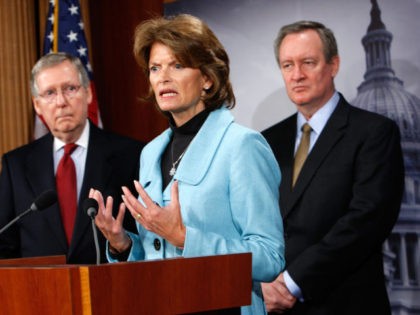 WASHINGTON - JANUARY 12: U.S. Sen. Lisa Murkowski (R-AK) speaks as Senate Minority Leader Sen. Mitch McConnell (R-KY) (L) and Sen. Mike Crapo (R-ID) (R) listen during a news conference on Capitol Hill January 12, 2010 in Washington, DC. The Republican legislators briefed the media on a recent Congressional delegation …