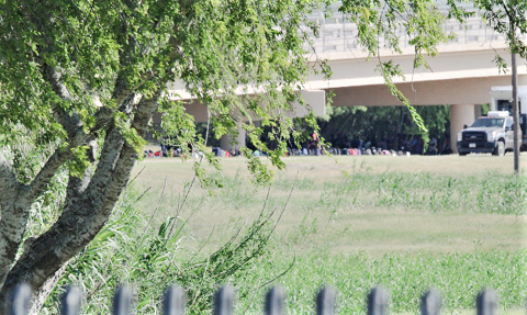 Officials line up hundreds of migrants' backpacks near the temporary outdoor detention area set up by Del Rio Sector officials due to overcrowding. (Photo: Randy Clark/Breitbart Texas)