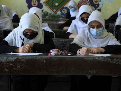 TOPSHOT - Schoolgirls attend class in Herat on August 17, 2021, following the Taliban stunning takeover of the country. (Photo by AREF KARIMI / AFP) (Photo by AREF KARIMI/AFP via Getty Images)