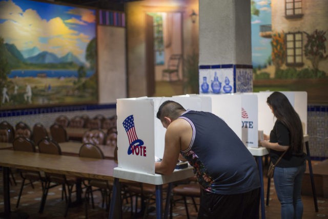 LOS ANGELES, CA - NOVEMBER 08: Latinos vote at a polling station in El Gallo Restaurant on