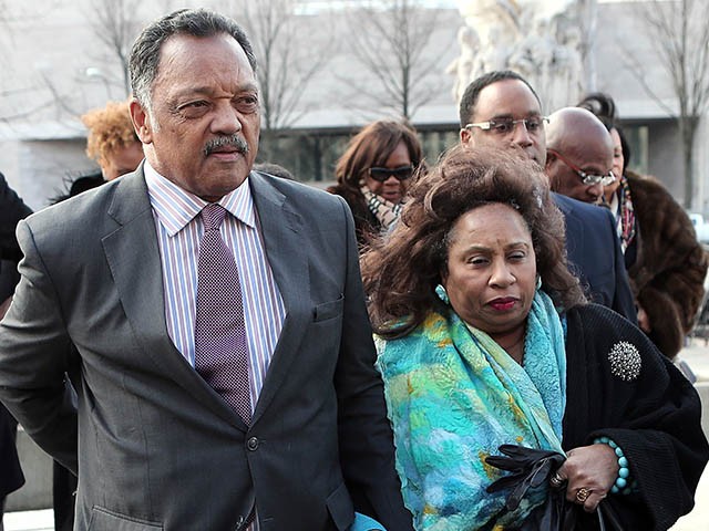 WASHINGTON, DC - FEBRUARY 20:  Rev. Jesse Jackson (L) and his wife Jacqueline Lavinia Brown (R) arrive at U.S. District Court for a hearing involving his son, former Rep. Jesse Jackson Jr., February 20, 2013 in Washington, DC. Jackson Jr. and his wife, Sandi Jackson, are expected to plead guilty to federal charges after being accused of spending more than $750,000 in campaign funds to purchase luxury items, memorabilia and other goods.  (Photo by Win McNamee/Getty Images)