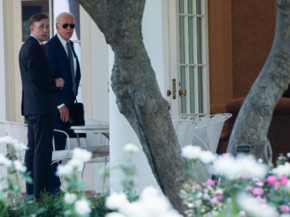 US President Joe Biden walks with National Security Advisor Jake Sullivan (L) to the Oval Office of the White House in Washington, DC, July 27, 2021, after traveling to the Office of the Director of National Intelligence in Virginia. (Photo by SAUL LOEB / AFP) (Photo by SAUL LOEB/AFP via …