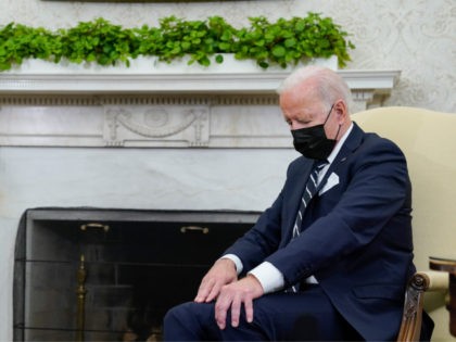 Chinese - President Joe Biden listens as he meets with Israeli Prime Minister Naftali Benn