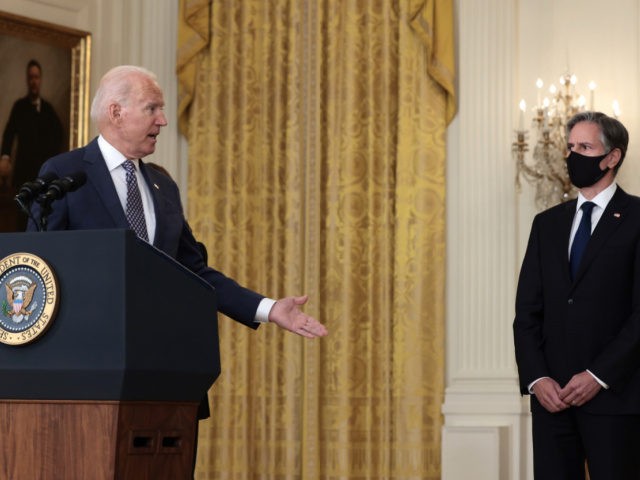 U.S. President Joe Biden gestures to Secretary of State Antony Blinken as he gives remarks on the U.S. military’s ongoing evacuation efforts in Afghanistan from the East Room of the White House on August 20, 2021 in Washington, DC. The White House announced earlier that the U.S. has evacuated almost …