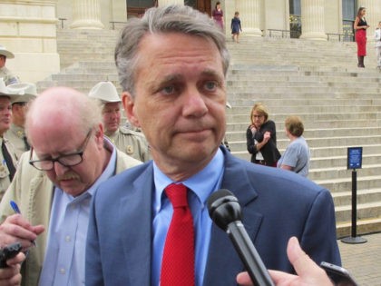In this Sept. 27, 2017, file photo, Kansas Lt. Gov. Jeff Colyer speaks to reporters outside the Statehouse in Topeka, Kan. Colyer begins his tenure Wednesday, Jan. 31, 2018, as Kansas governor replacing Gov. Sam Brownback, his GOP predecessor who is stepping down to become U.S. ambassador-at-large for international religious …