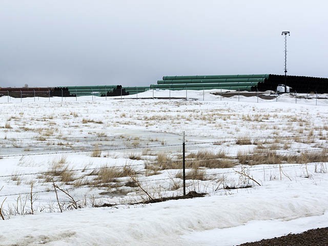 This March 11, 2020 photo provided by the Bureau of Land Management shows a storage yard north of Saco, Mont., for pipe that will be used in construction of the Keystone XL oil pipeline near the U.S.-Canada border. A Canadian company said Monday, April 6, 2020, that it's started construction on the long-stalled Keystone XL oil sands pipeline across the U.S.-Canada border, despite calls from tribal leaders and environmentalists to delay the $8 billion project amid the coronavirus pandemic. (Al Nash/Bureau of Land Management via AP)