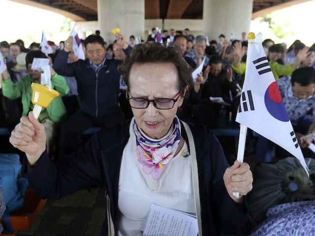 A South Korean Christian prays wishing for peace on the Korea peninsular during a service to mark the 69th anniversary of the outbreak of the Korean War near the Imjingang Station, near the demilitarized zone of Panmunjom, in Paju, South Korea, Tuesday, June 25, 2019. South Korea and North Korea fought a devastating three-year war in the early 1950s that ended with an armistice, not a peace treaty. (AP Photo/Ahn Young-joon) (AP Photo/Ahn Young-joon)